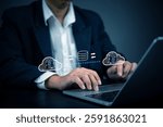 Businessman using cloud computing technology for data transfer and storage. Concept of cloud computing, data security, online storage, network infrastructure, and digital transformation in business.