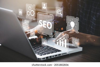 Businessman using a computer for analysis  SEO Search Engine Optimization Marketing Ranking Traffic Website Internet Business Technology Concept. - Shutterstock ID 2051802836