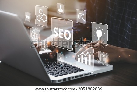Businessman using a computer for analysis  SEO Search Engine Optimization Marketing Ranking Traffic Website Internet Business Technology Concept.
