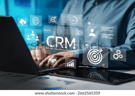 Businessman using computer and dashboard to analyze CRM data on virtual technology screen with CRM icon, customer relationship management concept for connecting business technology database.