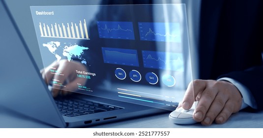 Businessman using computer dashboard analyzing sales data and financial report. Financial Management data System KPI connected in database for follow earnings,operations and sales data.