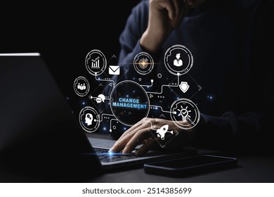Businessman using a computer to document Change management in organization and business concept with consultant presenting icons of strategy. Organizational transition and transformation
