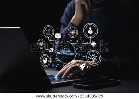Businessman using a computer to document Change management in organization and business concept with consultant presenting icons of strategy. Organizational transition and transformation