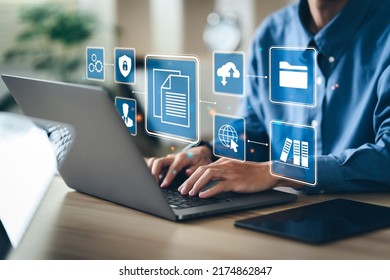 Businessman using a computer to document management concept, online documentation database and digital file storage system software, records keeping, database technology, file access, doc sharing.