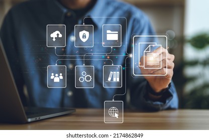 Businessman using a computer to document management concept, online documentation database and digital file storage system or software, records keeping, database technology, file access, doc sharing.