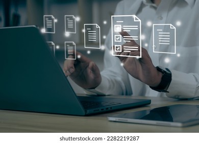 Businessman using a computer to document management concept, online documentation database and digital file storage system software, records keeping, database technology, file access, doc sharing.