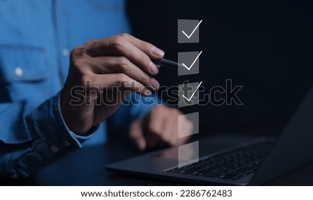 Businessman using computer doing online checklist survey. Business performance checklist, filling out digital form checklist, take an assessment, questionnaire, evaluation, online survey, online exam.
