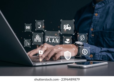 Businessman using a computer to Emergency Plan icon to learn and prepare in emergency situation .Business Evacuation Training concept. Concept of Emergency Preparedness Plan