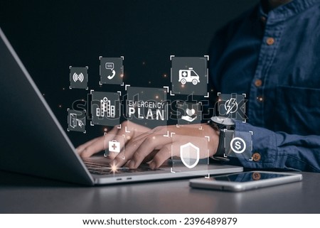 Businessman using a computer to Emergency Plan icon to learn and prepare in emergency situation .Business Evacuation Training concept. Concept of Emergency Preparedness Plan
