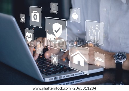 Businessman using a computer to insurance online for car, travel, family and life, financial and health insurance. Insurance concept.