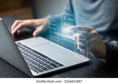 Businessman Using Computer Laptop On E Document On Digital Tablet , E-signing On E Document And Virtual Notepad On Virtual Screen , Electronic Signature , Paperless Office Concept