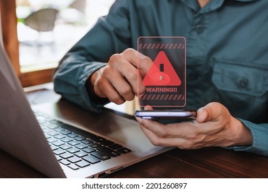 Businessman using computer laptop and smartphone with caution warning sing for notification error and virus detection spyware, Internet network security concept - Shutterstock ID 2201260897