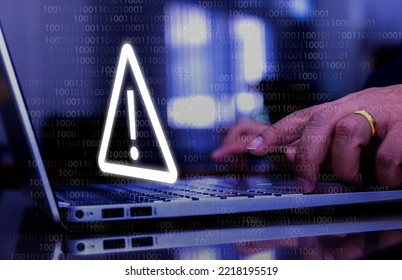 Businessman Using Computer Laptop With Triangle Caution Warning Sing For Notification Error And Maintenance Concept