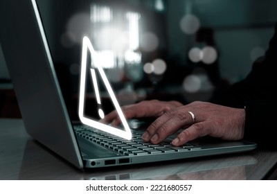 Businessman Using Computer Laptop With Triangle Caution Warning Sing For Notification Error And Maintenance Concept