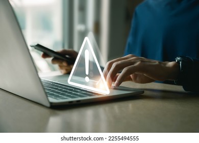 Businessman using computer laptop with triangle caution warning sing , Http 404 error not found page template concept.