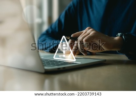 Businessman using computer laptop with triangle caution warning sing , Http 404 error not found page template concept.