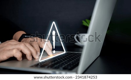 Businessman using computer laptop with triangle caution warning sing , Http 404 error not found page template concept. Triangle caution warning sing on laptop screen and Businessman using.