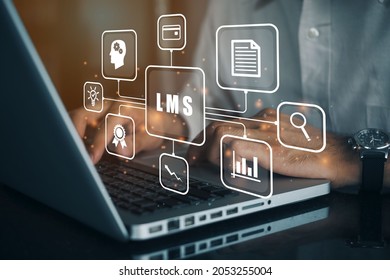 Businessman using a computer to LMS - Learning Management System web icon for lesson and online education, course, application, study, e learning, knowledge everywhere and every time.