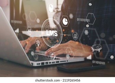 Businessman using a computer to LMS - Learning Management System web icon for lesson and online education, course, application, study, e learning, knowledge everywhere and every time.