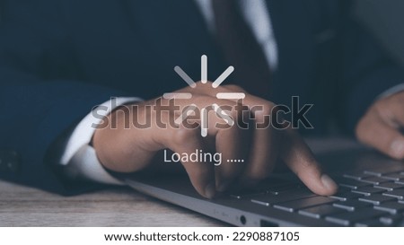 Businessman using computer for loading data application. download bar digital business data website. Concept of waiting for loading bar.