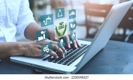 Businessman using computer to manage online information about net zero concept. natural environment neutral carbon A climate-neutral long-term strategy greenhouse gas emissions targets - Shutterstock ID 2230598327