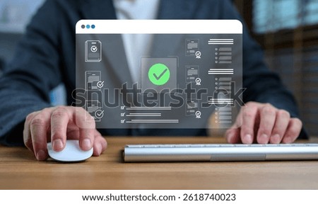 Businessman using computer mouse and keyboard to complete digital document verification process, with holographic checkmark and contract icons, representing online approval and certification.