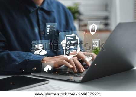 Businessman using computer to record document management concept, online document database and digital file storage system or software, record keeping, database technology, file access.