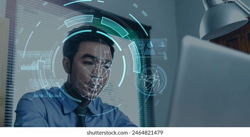 Businessman using computer scanning face ID to unlock security access with facial recognition technology for identification, with graphical tech illustration. Working in an office desktop.