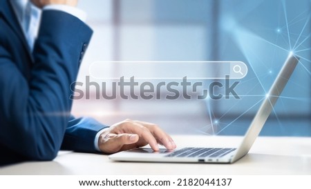 Businessman using computer searching information web browser webpage, Search Engine Optimization and Data Search Technology Concept, Internet network connecting online worldwide on office background