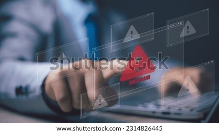 Businessman using computer with triangle caution warning sign for notification error. Notification error and maintenance, Programmer with hacker attacks, cyber crime and security.