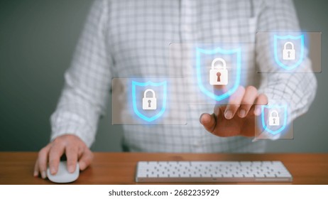 Businessman using computer with virtual lock icons, representing cybersecurity, data protection, privacy and secure online access. Technology concept internet safety and digital security.