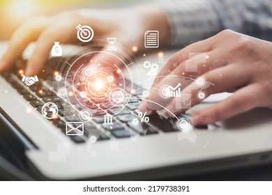 Businessman using a computer to virtual screen dashboard with project management with icons of scheduling, budgeting, communication. - Shutterstock ID 2179738391