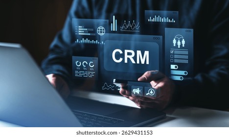 Businessman using CRM on smartphone with futuristic digital data charts, glowing UI elements, on dark background, concept of customer relationship management