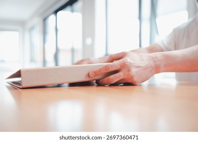 Businessman using data folder paper work siting on table in modern home office 
