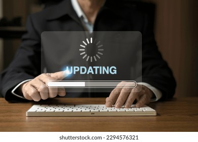 Businessman using desktop loading data with loading bar icon over a wireless , update concept and business transformation Loading icon on screen.