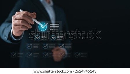 Businessman using digital checklist interface with pen, symbolizing task management, project planning, productivity system, and digital transformation for business efficiency and success.