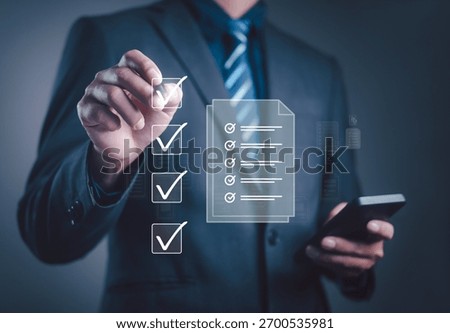 Businessman using digital checklist for task management, productivity planning, and performance tracking, representing organization, workflow efficiency, and business strategy in modern technology.