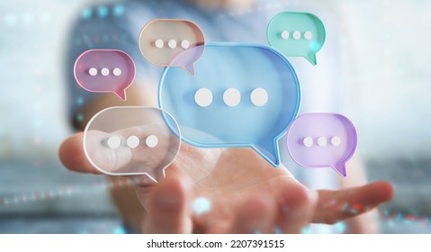 Businessman using digital colorful speech bubbles talk icons. Minimal conversation or social media messages floating over user hand. 3D rendering - Powered by Shutterstock