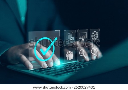 Businessman using digital document on laptop to approve business project proposal. Quality assurance concept, ISO certification and standards, satisfaction, service experience, show product and servic
