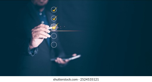 A businessman using a digital interface to check off tasks on a transparent screen, showcasing efficiency and modern technology. - Powered by Shutterstock