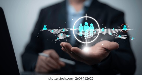 Businessman using digital interface for global customer targeting and audience segmentation strategy with futuristic network data visualization