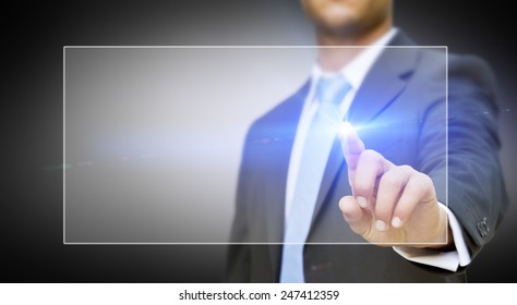 Businessman using digital interface with his fingers - Shutterstock ID 247412359