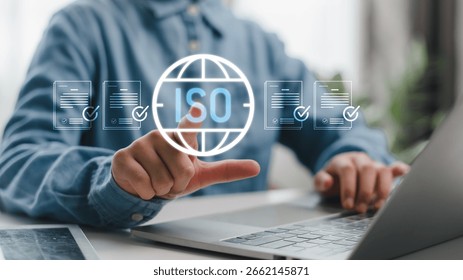 Businessman using digital interface for ISO certification and compliance verification, showing approved documents for quality control and standardization.