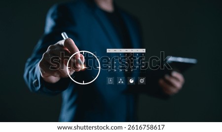 Businessman using digital interface to set time and schedule with calendar. Concept of time management, planning, and productivity optimization in the modern workplace.