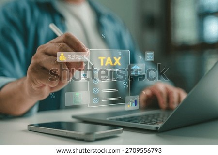 Businessman using digital interface for tax planning and filing with icons of checklist, percentage, and finance. Concept for online tax filing, accounting, fintech, and digital tax solution.