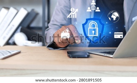 Businessman using digital security interface with cybersecurity shield, online payment protection, data privacy, financial technology, secure transactions, network protection and global cyber defense concept.