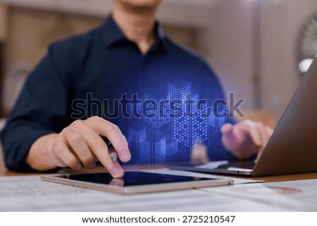 Businessman using digital tablet with 3D smart city hologram, concept of real estate technology, digital transformation, architecture urban planning innovation.