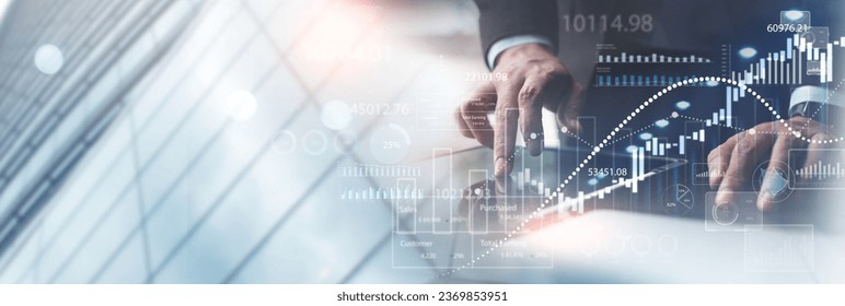 Businessman using digital tablet analyzing sales data and financial growth graph chart report. Business planning, strategy and development. Financial and banking. market research, business analysis - Powered by Shutterstock