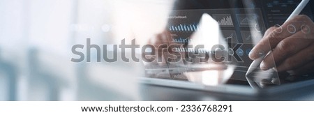 Businessman using digital tablet analyzing sales data and financial growth graph chart report. Business planning, strategy and development. Financial and banking. market research, data analysis
