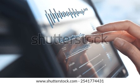 Businessman using digital tablet analyzing sales data and financial growth graph chart report. Business planning, strategy and development. Financial accounting. market research, data analysis